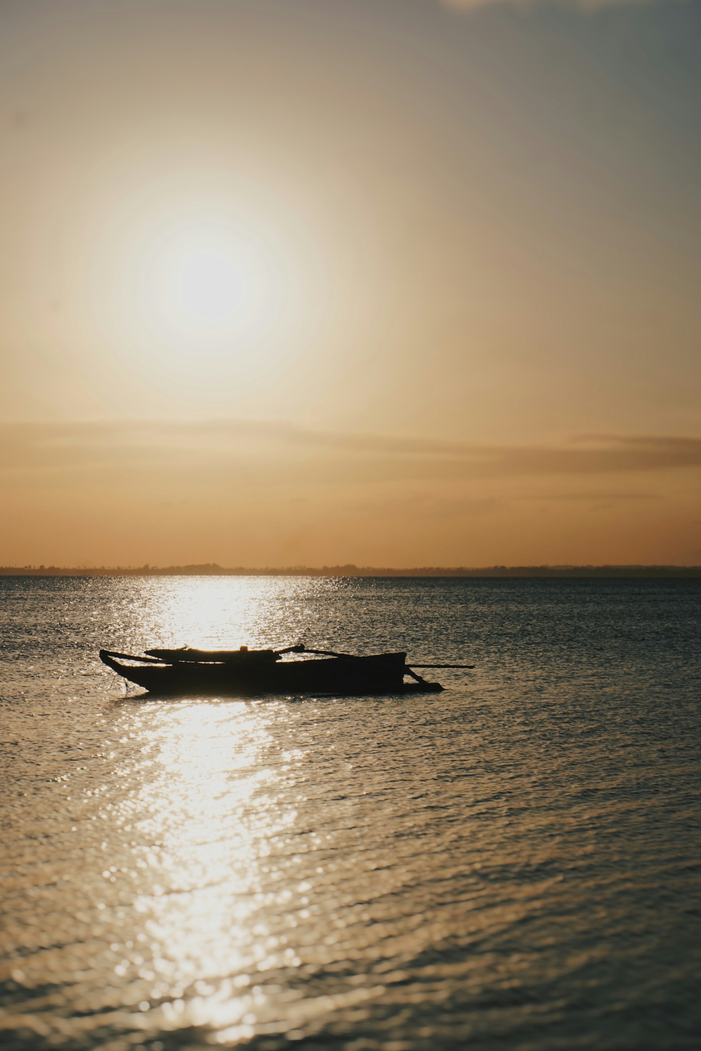 Traditional dhow sailing on calm Zanzibar water